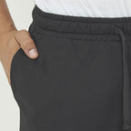 Pantaloni running slim fit con zip alla caviglia